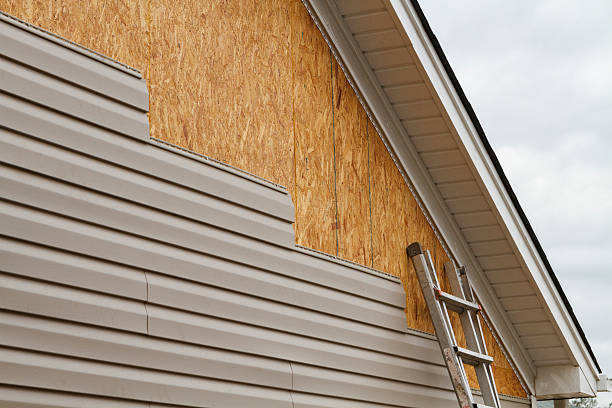 Professional Vinyl Siding technician working in Monroe, GA